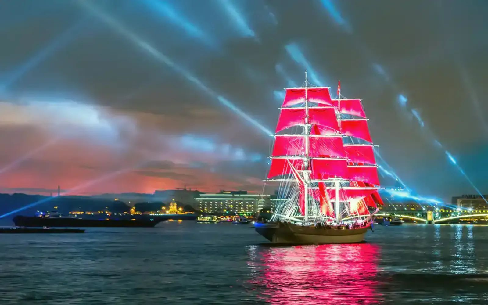Scarlet Sails under Spotlight Beams